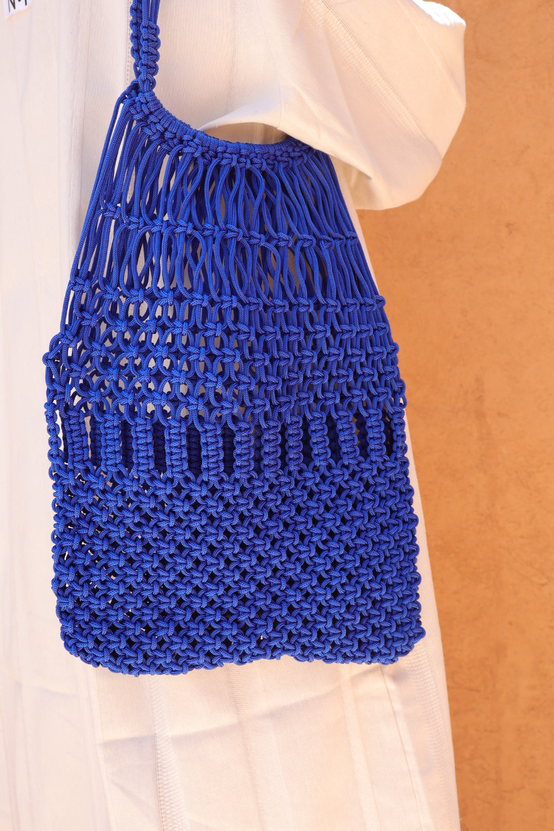 <img src="{{ 'sac-crochet-nylon-macrame-bleu.jpg' | asset_url }}" alt="Sac en crochet et nylon bleu Klein fait main, porté à l'épaule, style macramé, idéal pour un look tendance et artisanal, disponible en plusieurs coloris" title="Sac en crochet et nylon bleu fait main - Macramé">