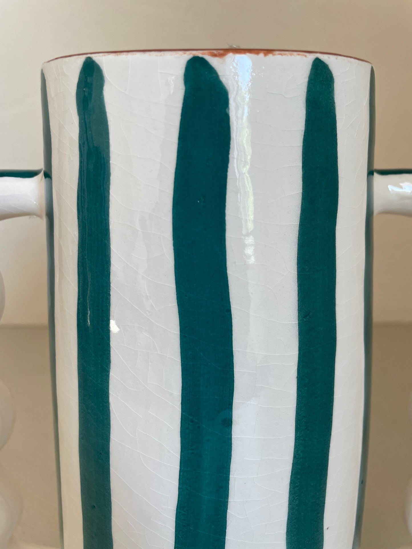 Abstract ceramic vase with green and white green stripes