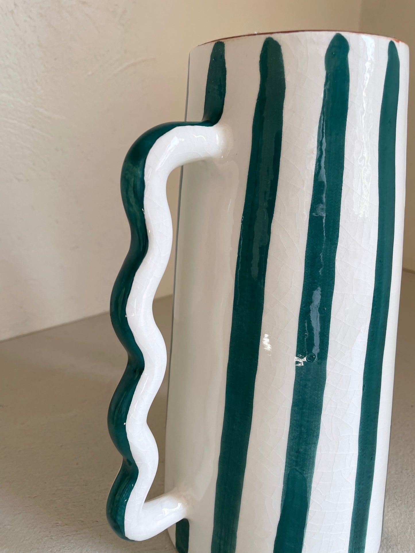 Abstract ceramic vase with green and white green stripes