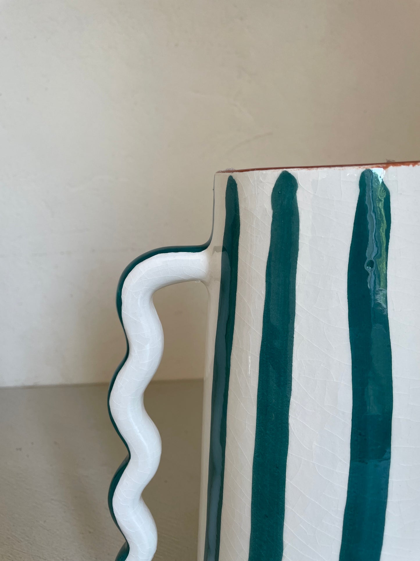 Abstract ceramic vase with green and white green stripes