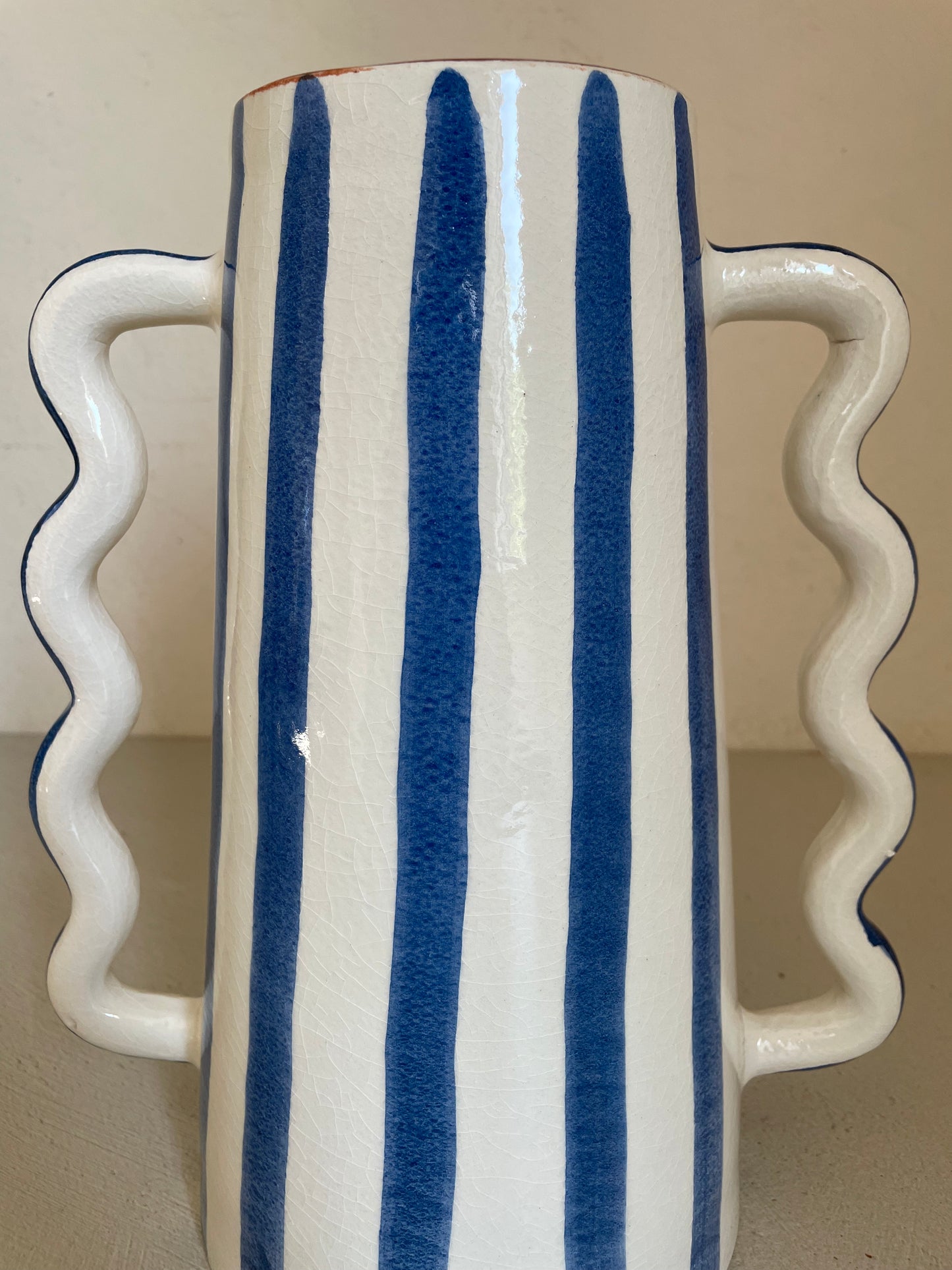 Ceramic abstract vase with blue and white stripes