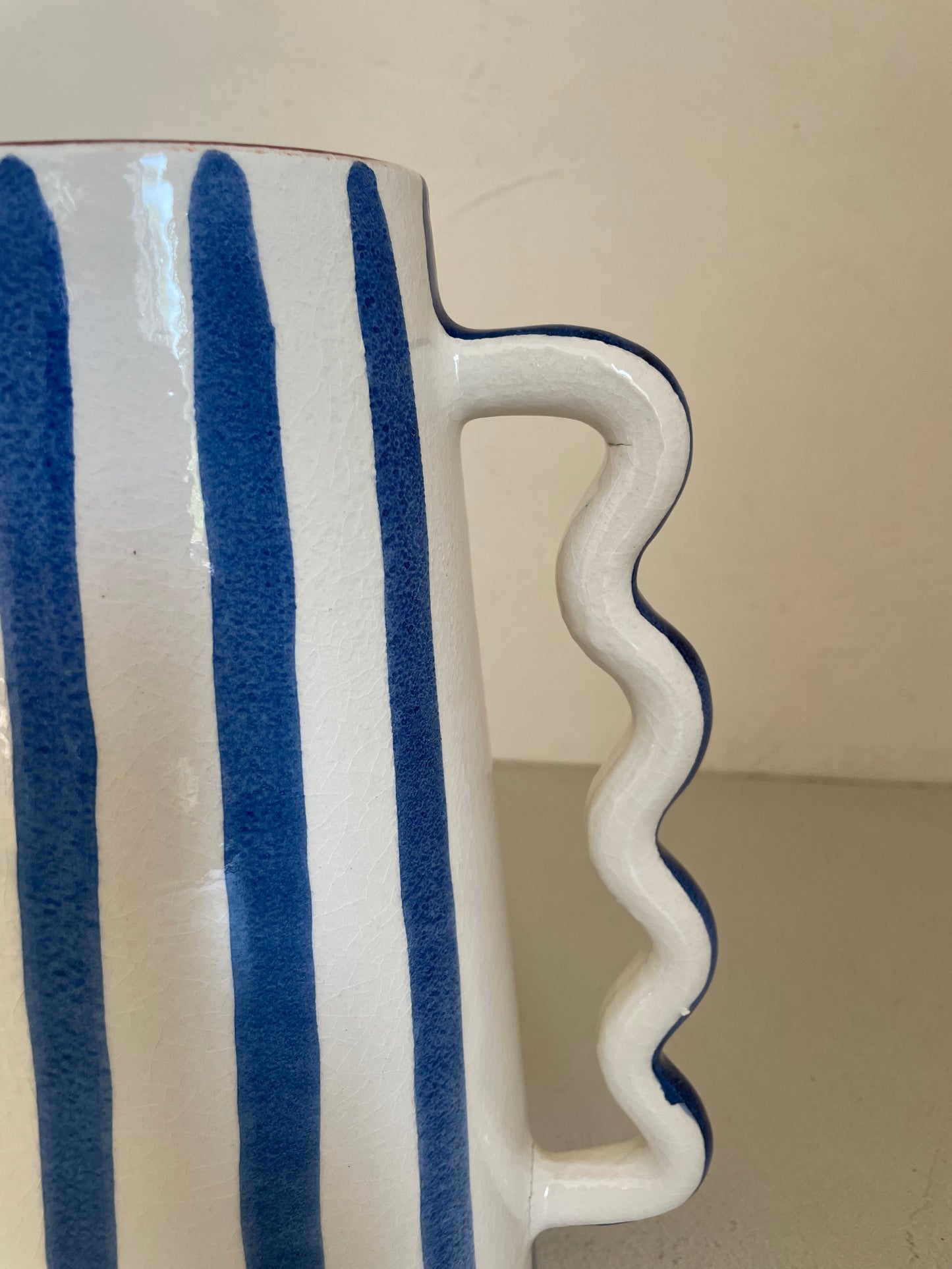 Ceramic abstract vase with blue and white stripes