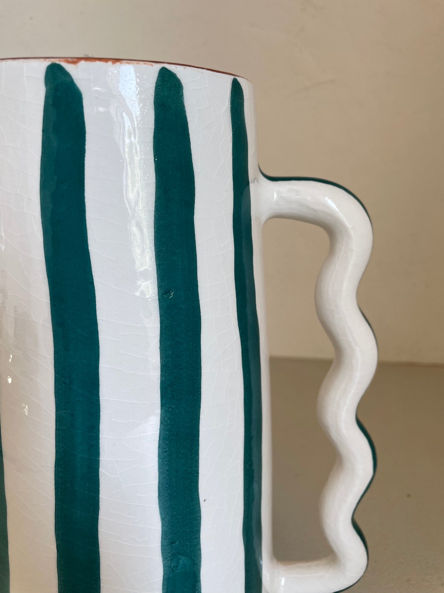 Abstract ceramic vase with green and white green stripes