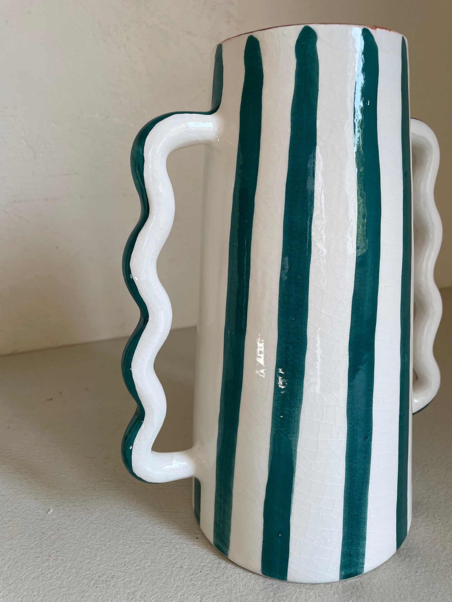 Abstract ceramic vase with green and white green stripes