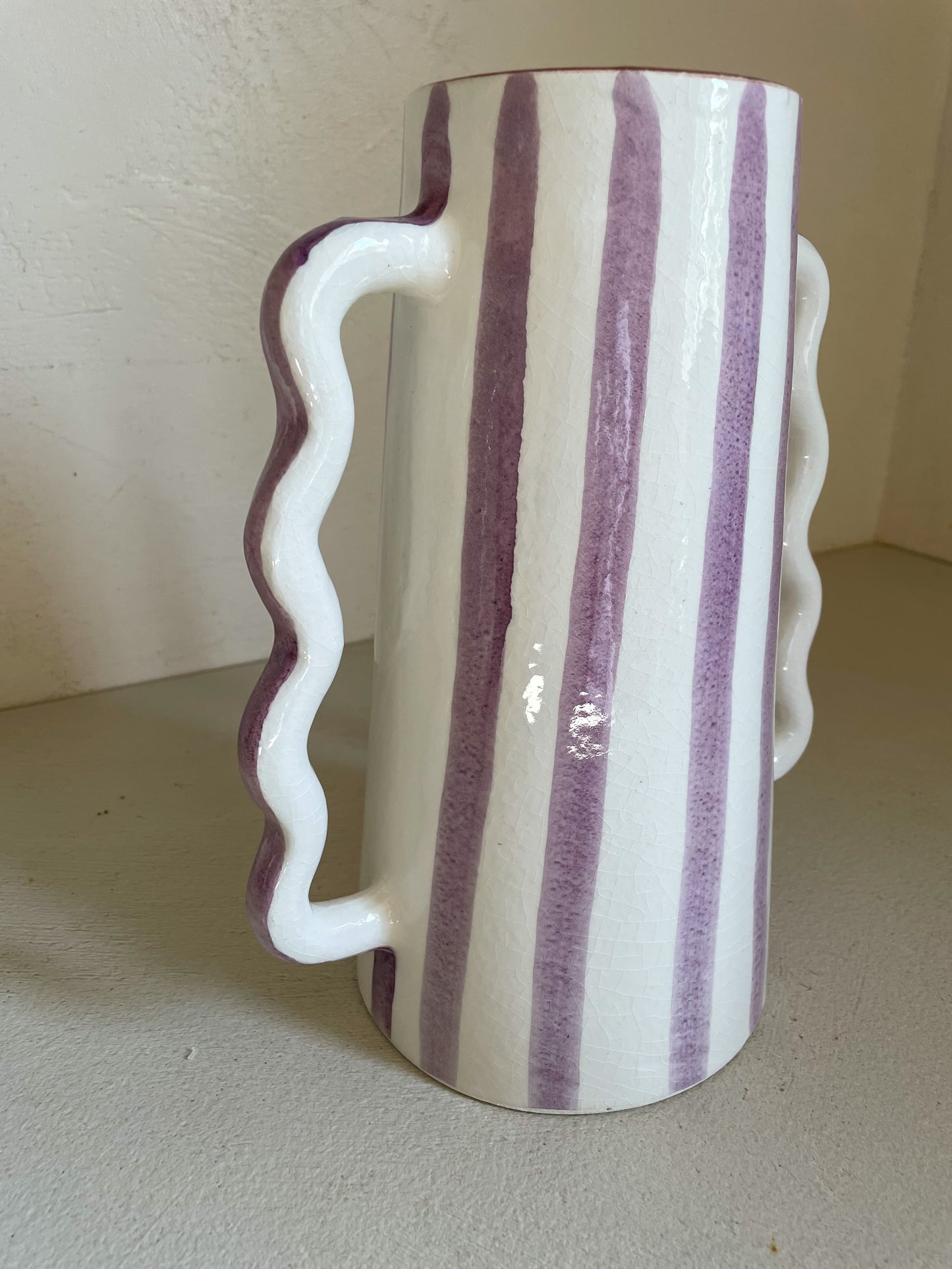 Abstract ceramic vase with lilac and white stripes