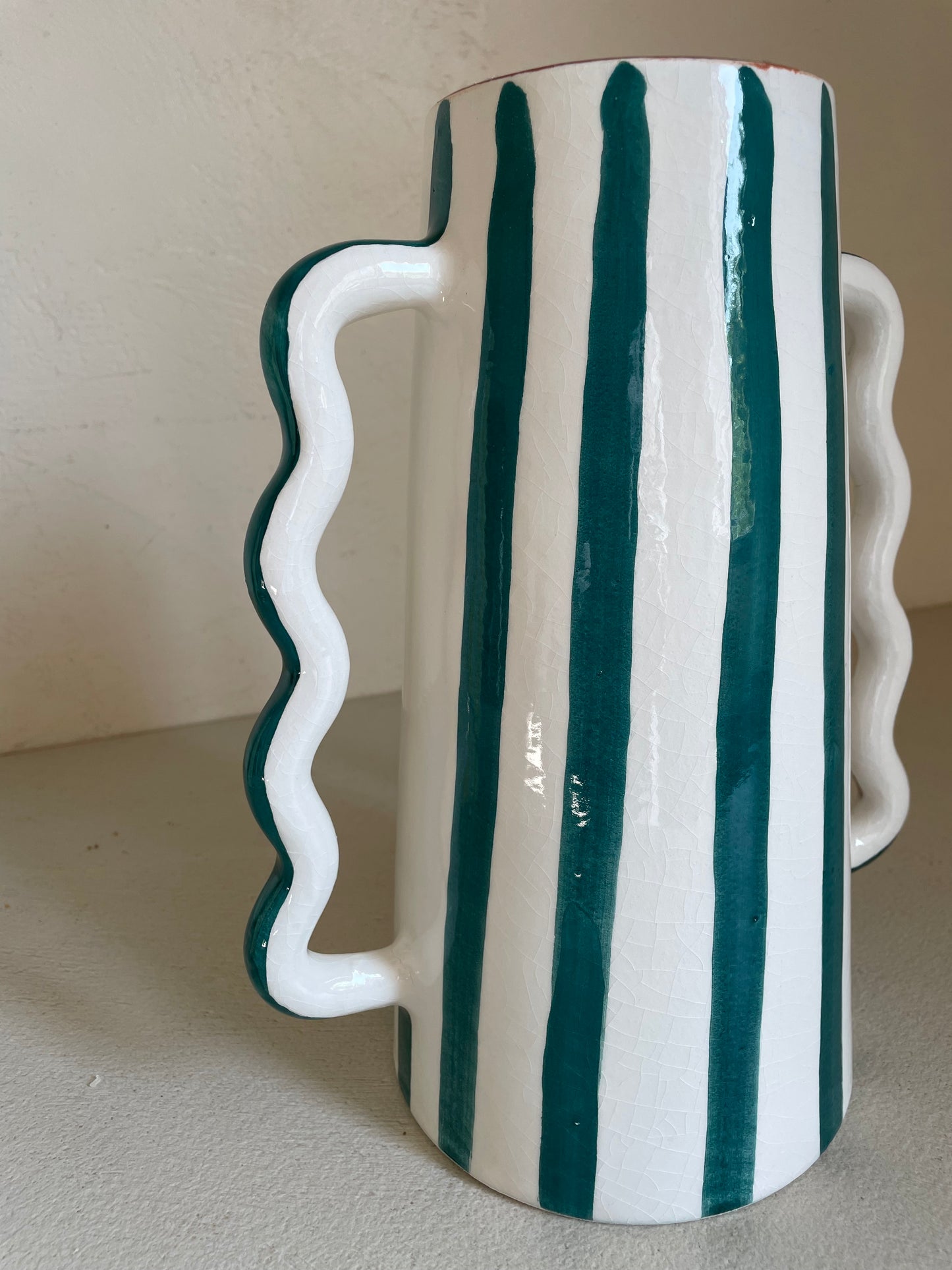 Abstract ceramic vase with green and white green stripes